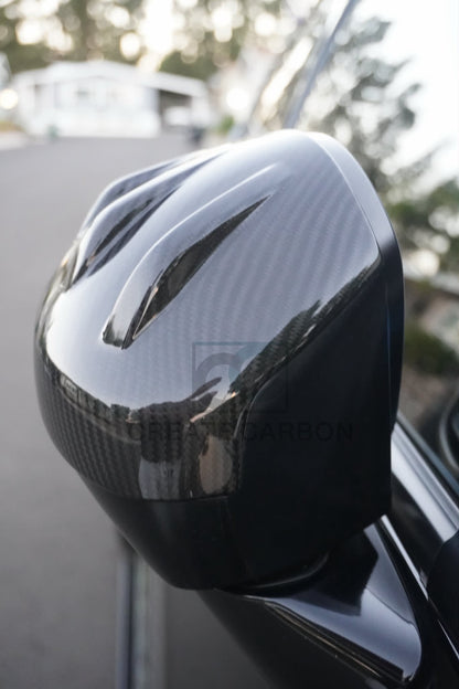 Close-up of the outer edge and carbon fiber weave of an Acura Integra Type S DE5 side mirror cap.